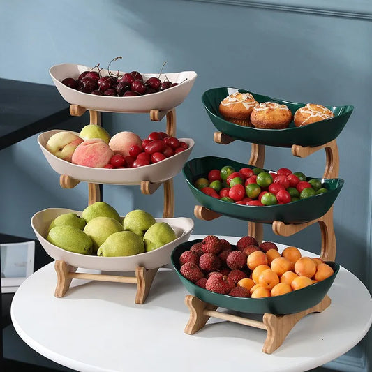 Elegant Table Setting: Plates, Fruit Bowl, Cake Trays, and Wooden Tableware Collection